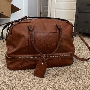 The perfect weekend bag or carry on. Vegan leather with a zip at the bottom too